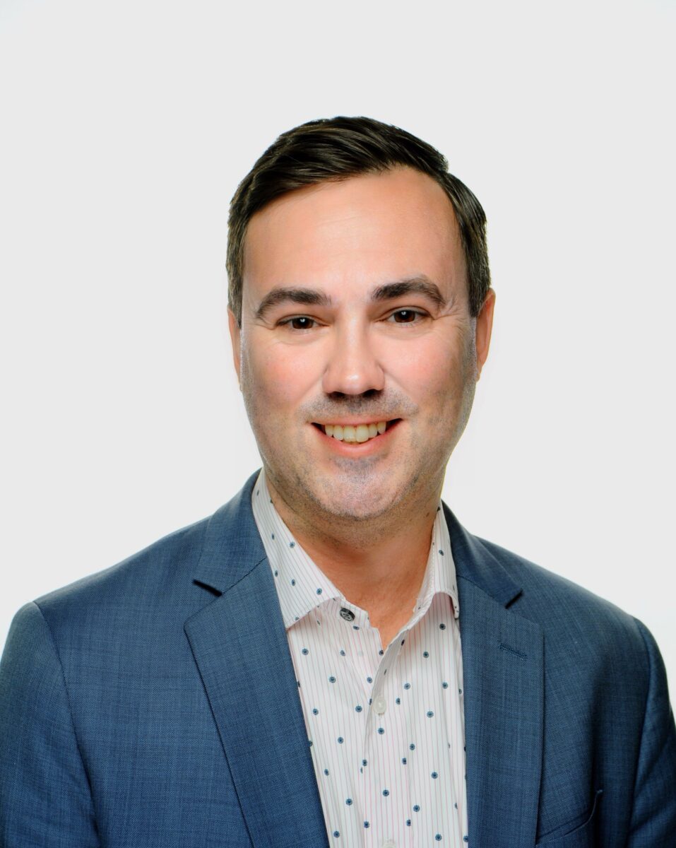 Kyle Souligne smiling at SIIM Annual Meeting, engaging with radiology professionals and showcasing innovative medical imaging solutions.