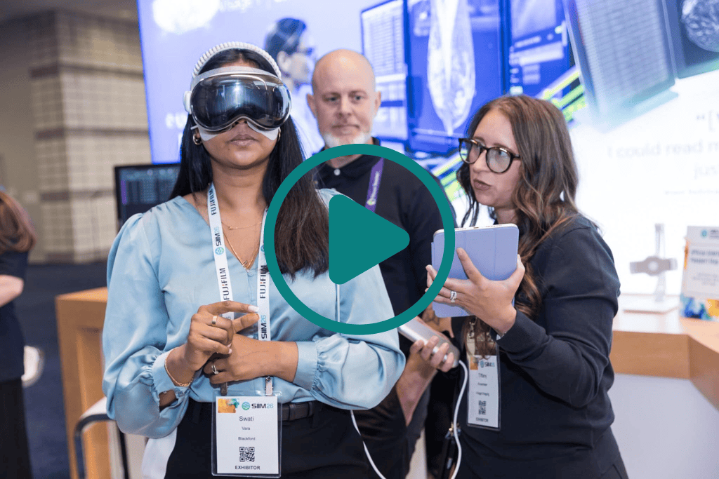 Attendees at the SIIM Annual Meeting explore new medical imaging technology with virtual reality headset and tablet.
