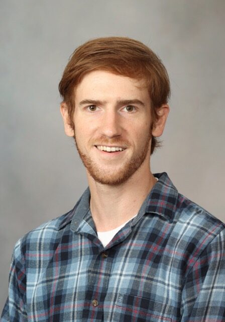 Portrait of Adam Dachowicz, PhD, at the SIIM Annual Meeting, showcasing advancements in medical imaging technology and research.