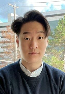 Portrait of Vincent Dong, MS, attending the SIIM Annual Meeting, showcasing a professional image of a healthcare professional in a modern urban setting.