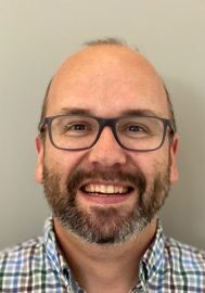 Brad Genereaux, FSIIM, speaking at the SIIM Annual Meeting 2023, showcasing innovative medical imaging solutions.