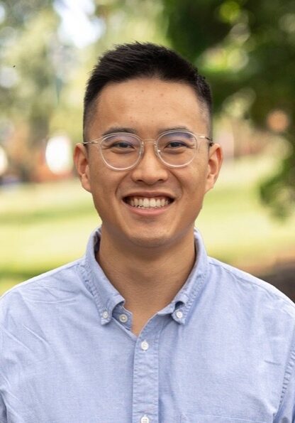 Young professional Gabriel Lau smiling outdoors at SIIM Annual Meeting, showcasing engagement in medical imaging and health informatics.