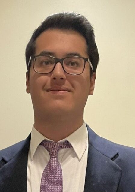 Professional portrait of Krish Malik attending the SIIM Annual Meeting, showcasing medical imaging expertise and networking within the radiology community.