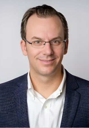Professional headshot of Lyle McMillin, MBA, attending the SIIM Annual Meeting, showcasing healthcare and medical imaging expertise.