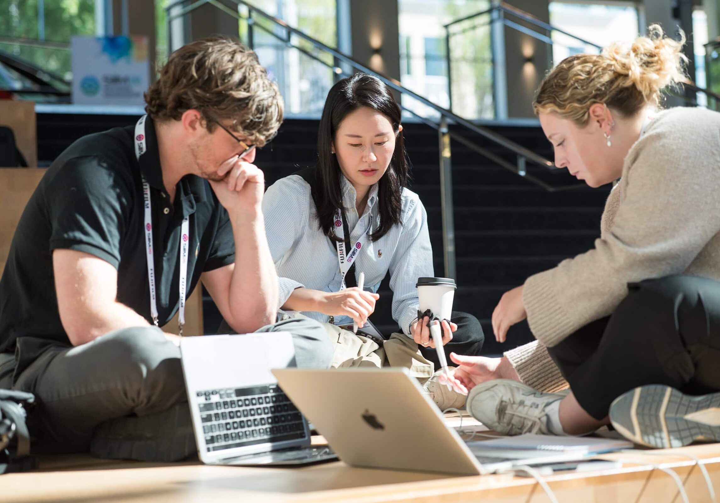 Innovative medical professionals collaborating at SIIM Annual Meeting, focusing on medical imaging, health tech, and digital health solutions in a dynamic conference environment.