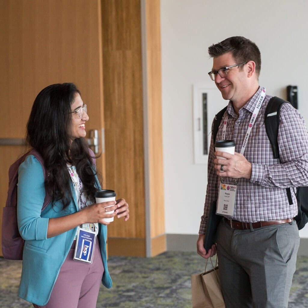1. Attendees networking at the SIIM Annual Meeting, showcasing medical imaging professionals engaging in discussions during the conference.