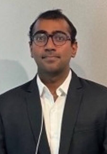 Senior professional attending SIIM Annual Meeting focused on medical imaging and informatics.