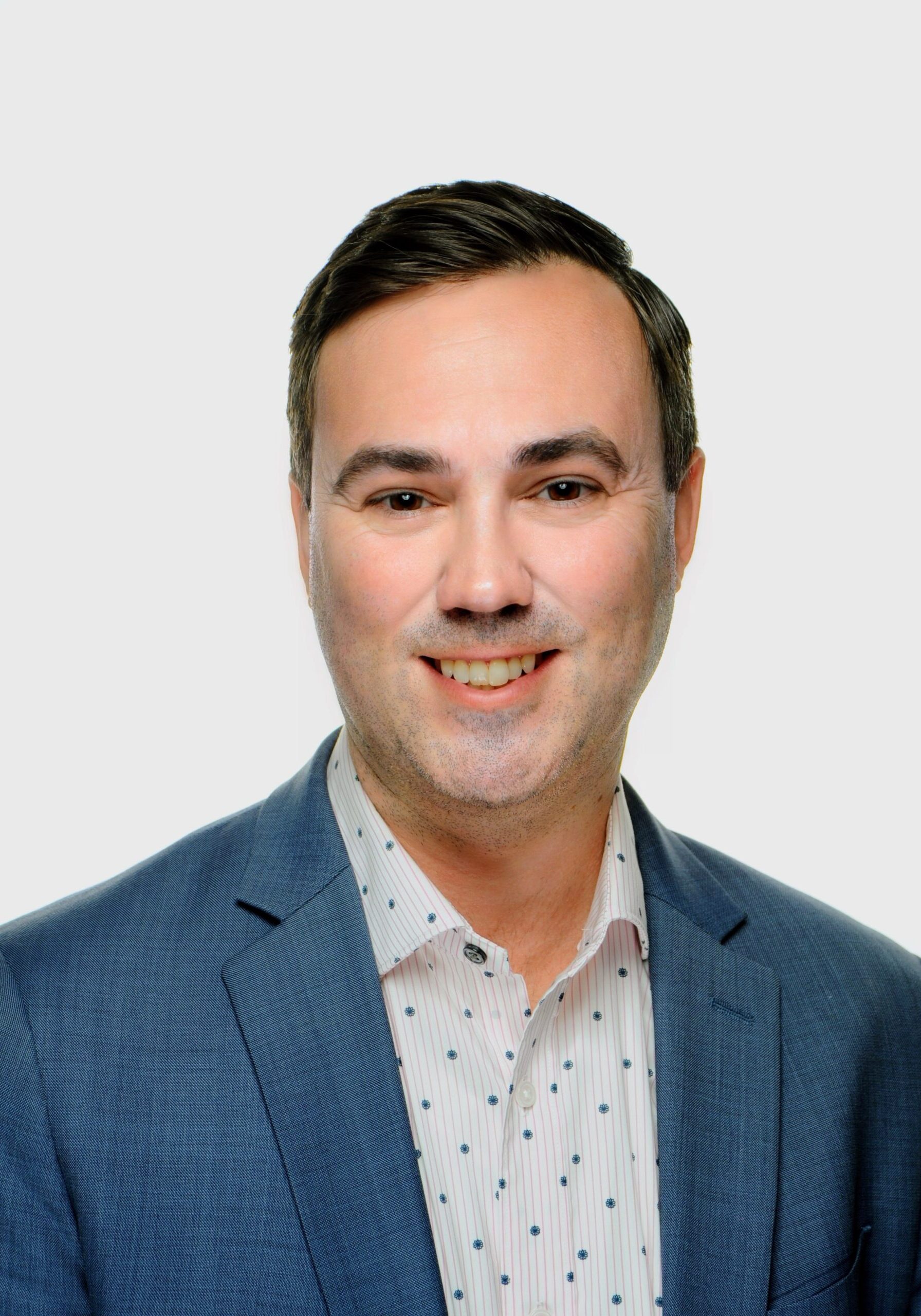 Kyle Souligne smiling at SIIM Annual Meeting, engaging with radiology professionals and showcasing innovative medical imaging solutions.