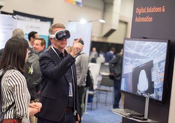 Person using VR goggles at a conference