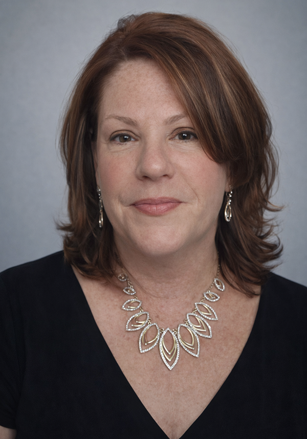 Elyse Thomas, a professional attending the SIIM Annual Meeting, is pictured here. She is wearing a black top and elegant jewelry, representing her participation in the medical imaging and informatics.