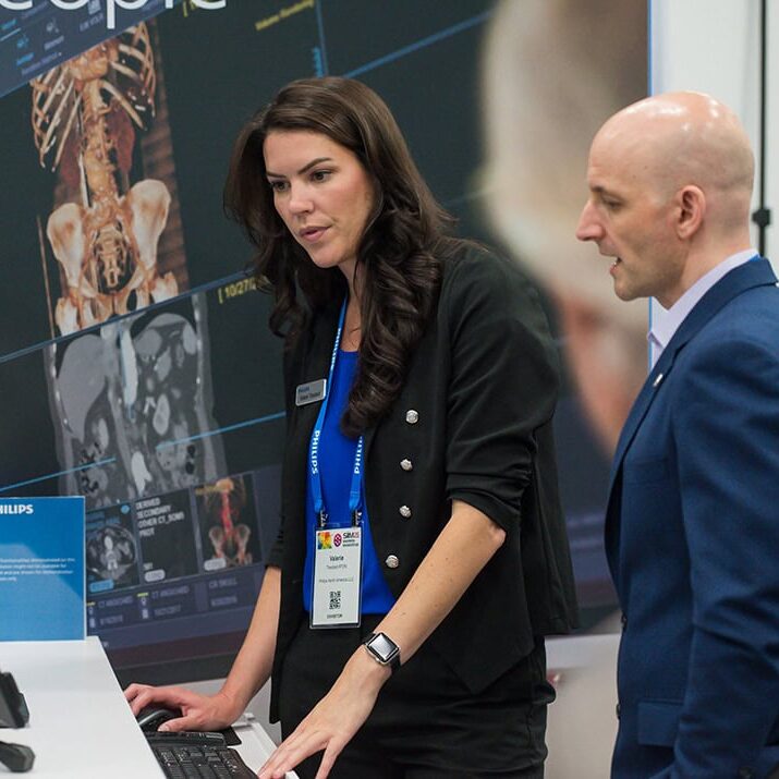 Women showing a client something on a laptop